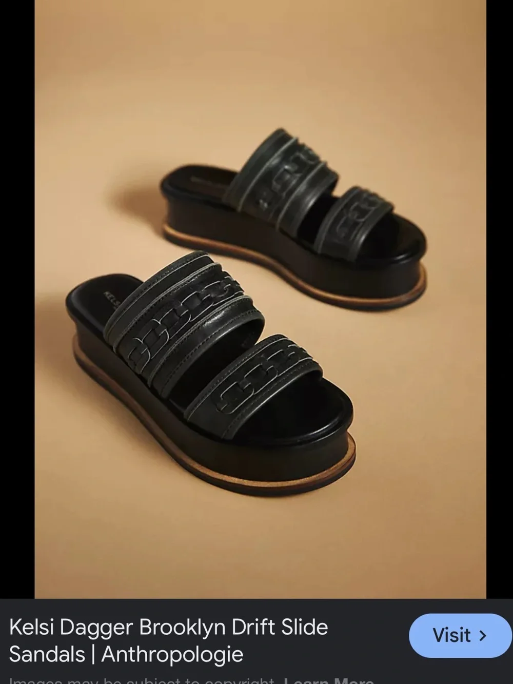 Kelsi Dagger Brooklyn Drift platform slide sandals in black leather featuring 7
